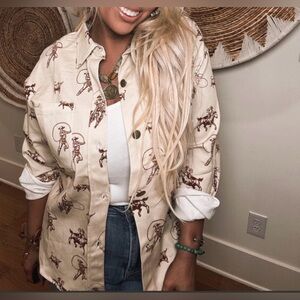 NWT Urban Daizy Western Rodeo Print Top with a Relaxed Fit.